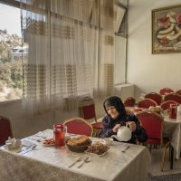 A woman dines at the Koha Obi Gharm sanatorium
